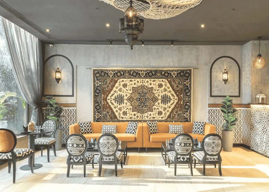 moroccan-restaurant-interior-design-with-a-large-rug-from-the-ceiling